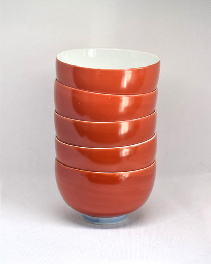 Koransha tea cup set featuring a single red and white porcelain bowl viewed from the side