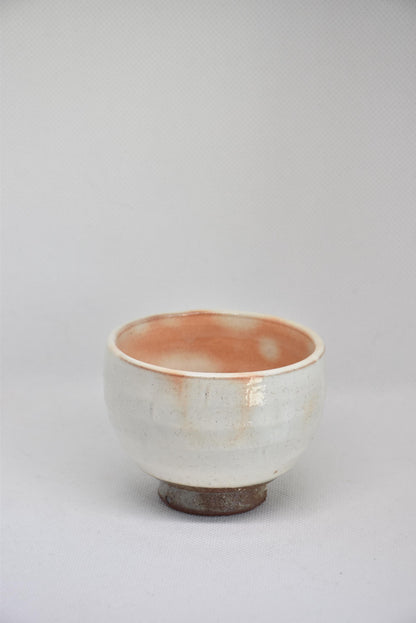 Set Of 5 White Kumidashi Teacups single cup angled view showing the earthy dark foot and white ceramic glaze