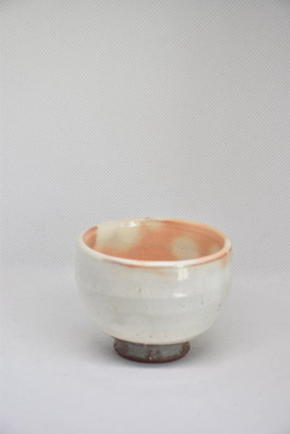 Set Of 5 White Kumidashi Teacups single ceramic cup viewed from a slight angle on a neutral background
