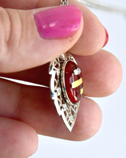Okagaki Kōtoku vintage necklace side view showing depth of red oval center and frame
