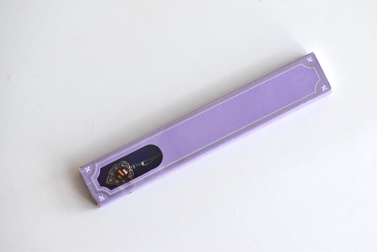 Okagaki Kōtoku vintage necklace inside its original purple presentation box