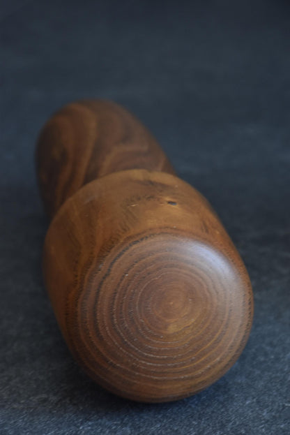 Usaburo kokeshi doll top view showing the circular wood grain of the head