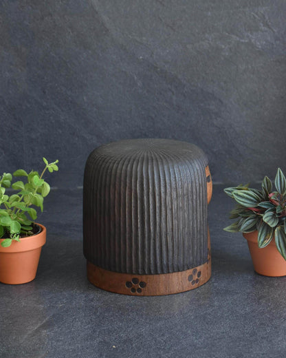 Sanpei Yamanaka kokeshi side view highlighting the dark carved wooden hair texture