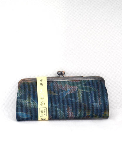Blue Oshima Tsumugi Silk Gamaguchi Coin Purse centered front view with its paper authenticity band attached.