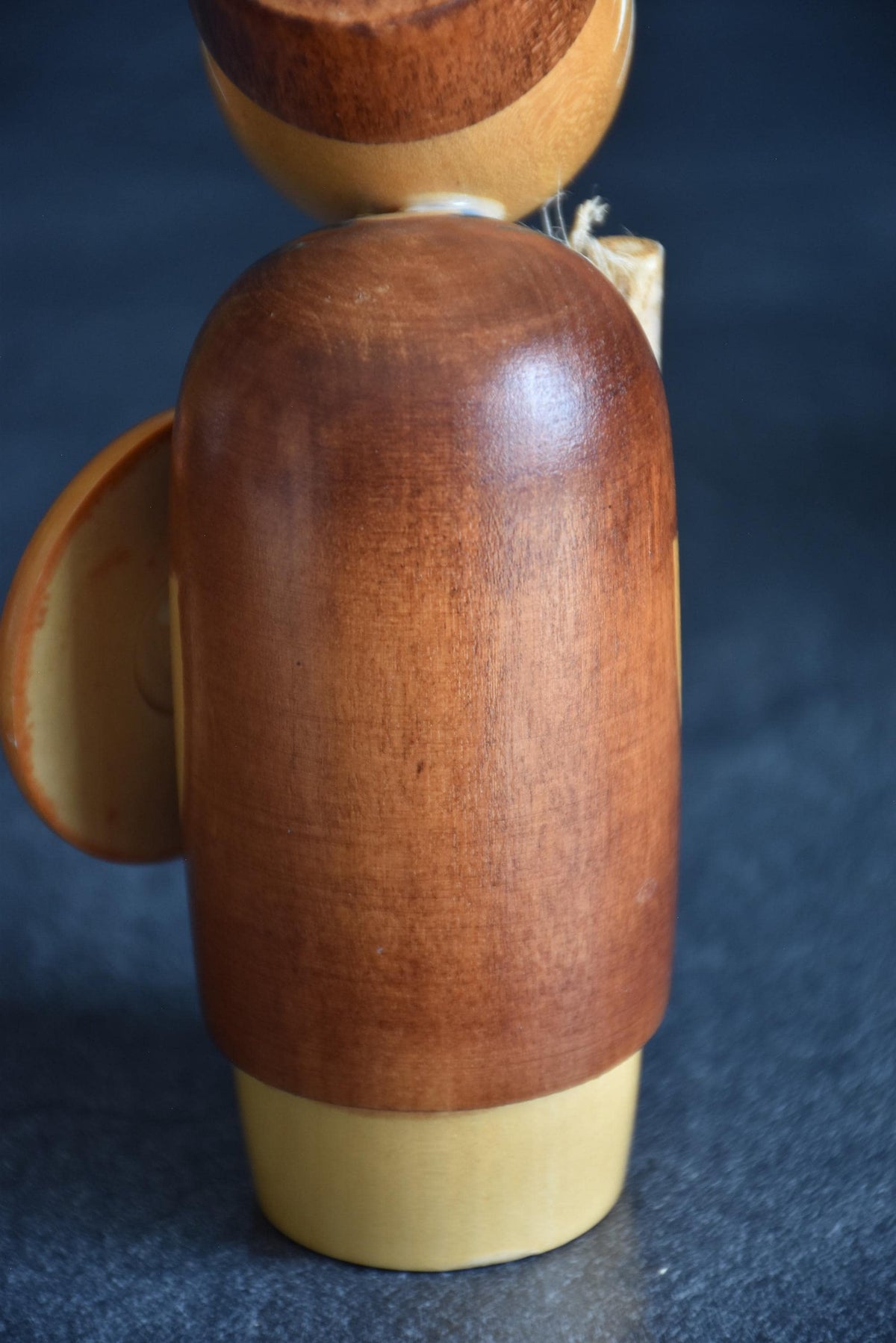 Hajime Miyashita Creative Kokeshi Matsuo Basho showing a rear view of the natural wood grain body