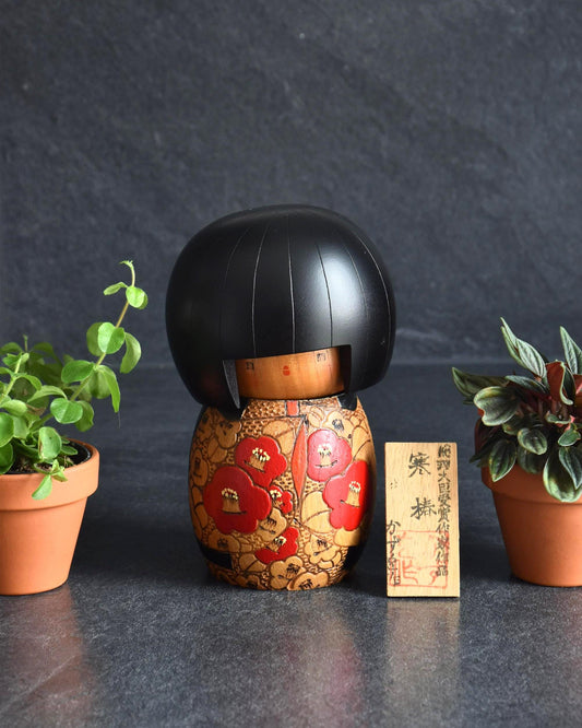 Kazuo Takamizawa Sosaku Kokeshi Tsubaki Camelia Doll with red and orange kimono patterns