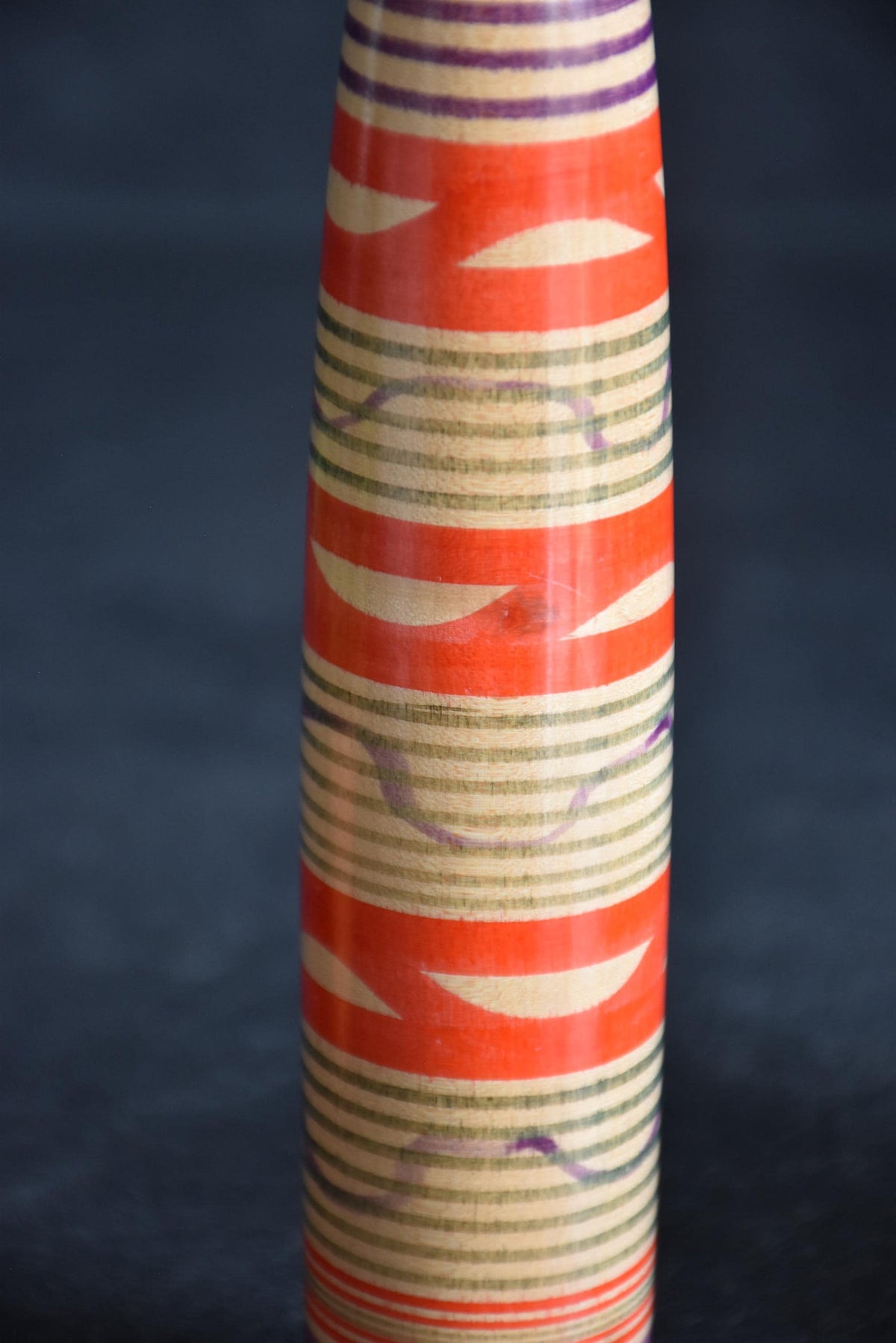 Tsuchiyu kokeshi doll lower body pattern detail with horizontal lathe-spun bands