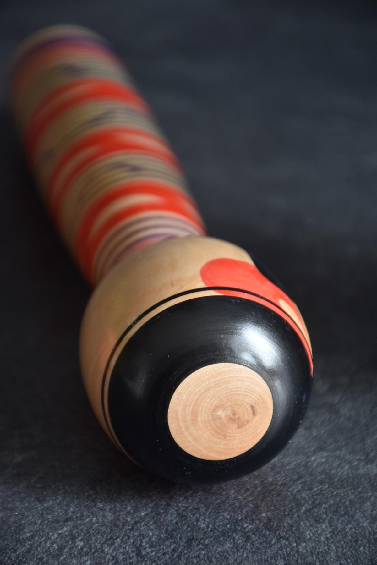 Tsuchiyu kokeshi doll top of the head showing black concentric circle motif