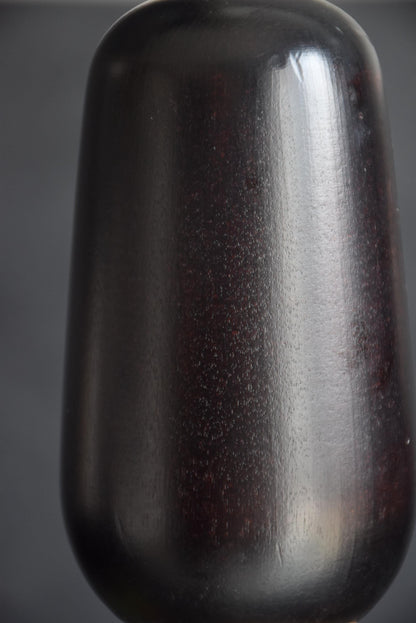 Kazuo Takamizawa sosaku kokeshi doll close up of the smooth dark polished hair element