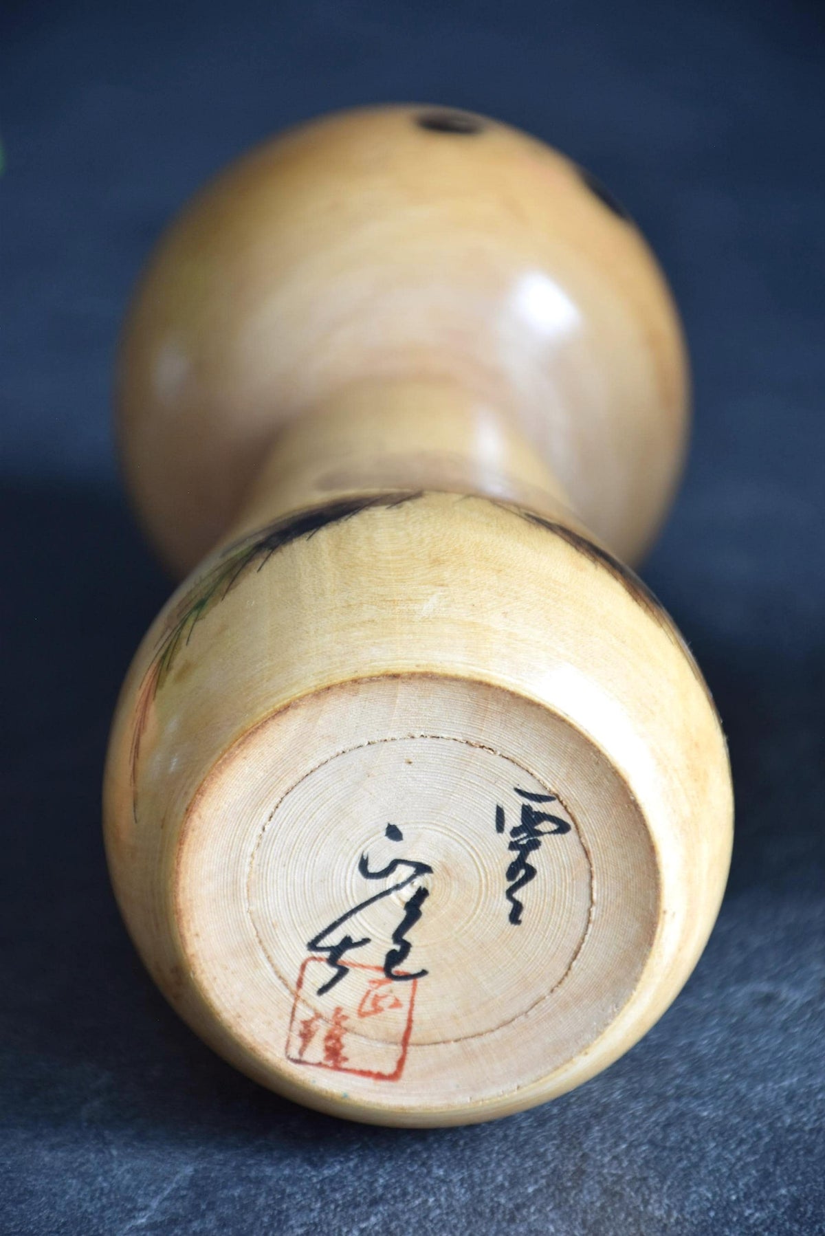 Masao Watanabe kokeshi doll base with artisan signature and red stamp