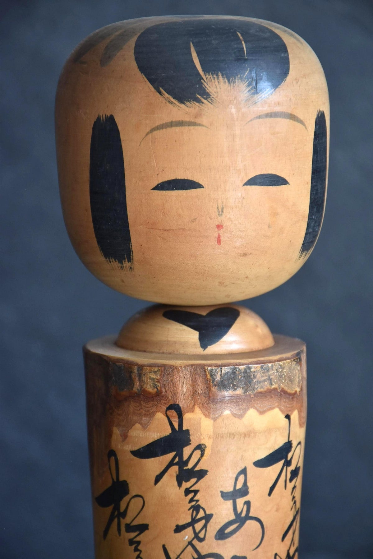 Large Wooden Kokeshi Doll Landscape Calligraphy close-up of the painted face and hairstyle