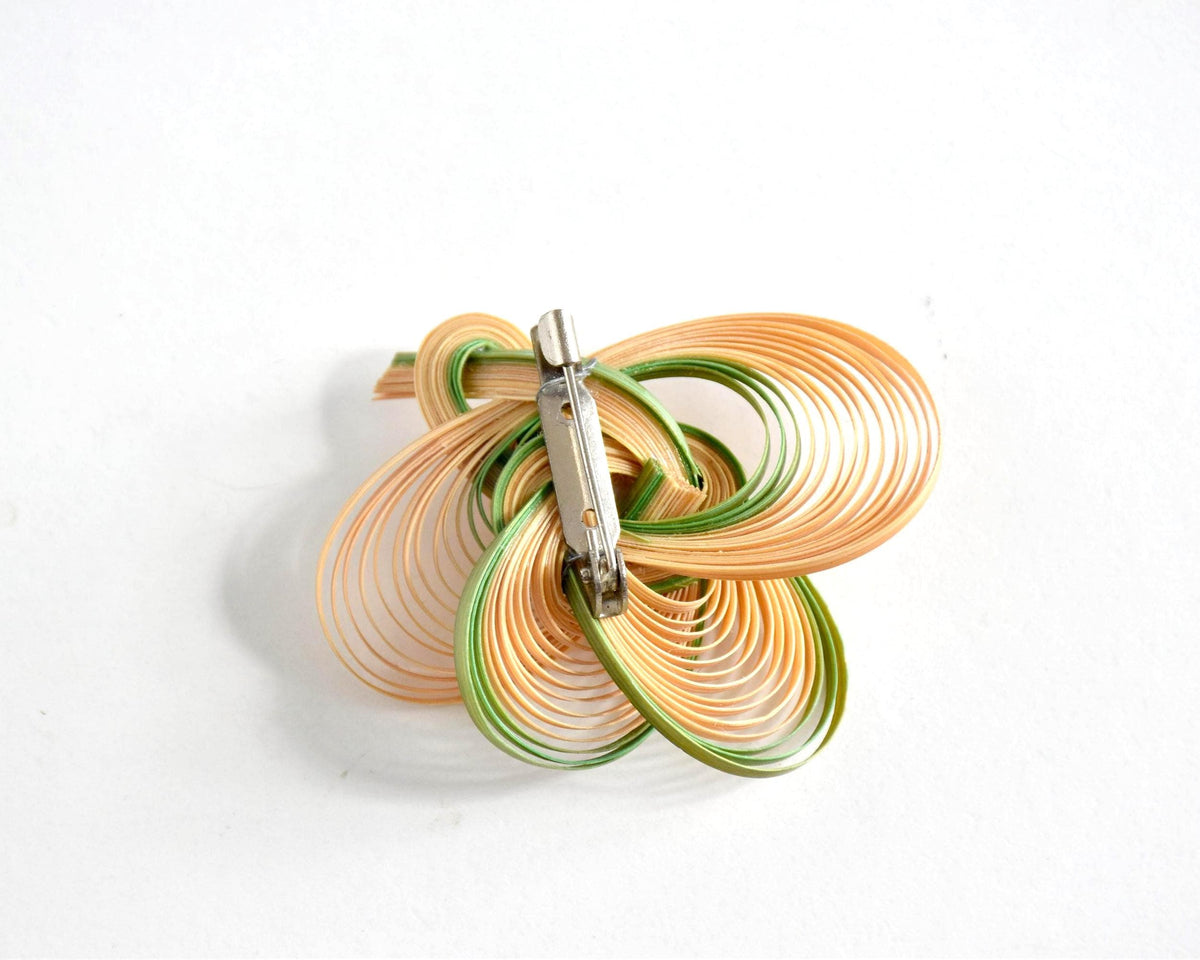 Hand-Woven Bamboo Knot Brooch In Beige And Green showing the back clasp