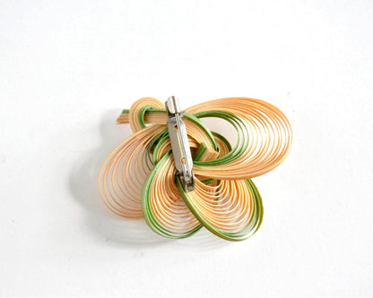 Hand-Woven Bamboo Knot Brooch In Beige And Green showing the back clasp