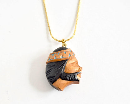 Ainu handcarved wood pendant necklace back view of the bearded man profile