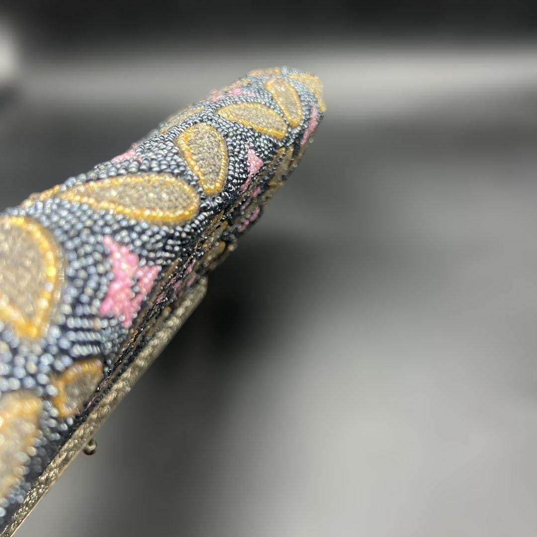 Japanese beaded handbag side profile showing the slim depth and frame alignment