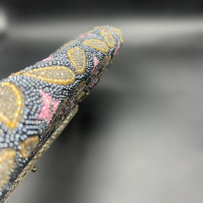 Japanese beaded handbag side profile showing the slim depth and frame alignment