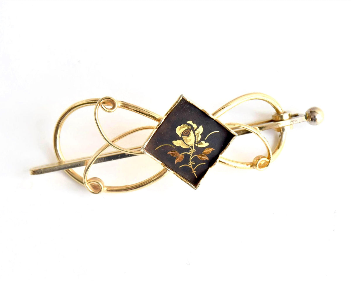 Floral Zogan Damascene Hair Ornament Gold And Black front view showing the floral Zogan inlay motif