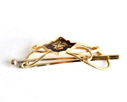 Floral Zogan Damascene Hair Ornament Gold And Black side view showing the curved shape of the metal