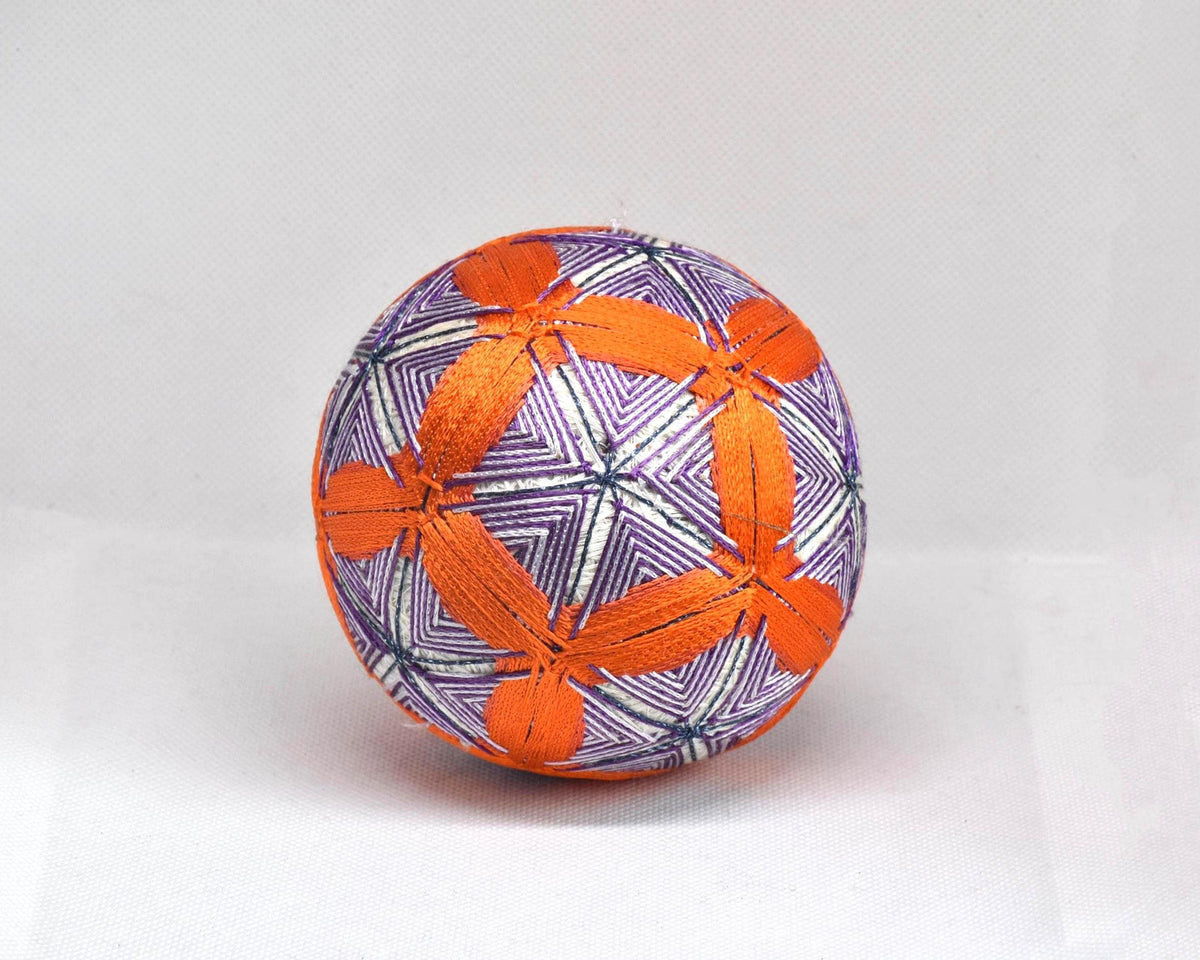 Hand-Embroidered Temari Ball Orange And Purple table scatter shown from another angle