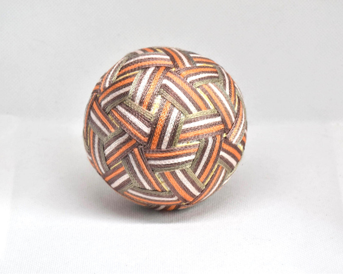 Hand-Embroidered Japanese Temari Ball folk art table scatter showing another angle of the colorful stitched design