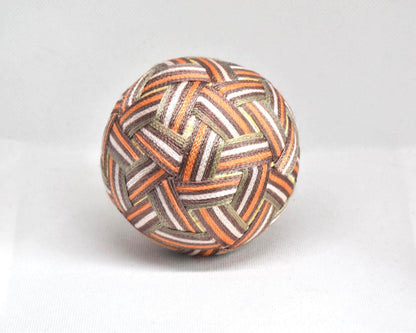 Hand-Embroidered Japanese Temari Ball folk art table scatter showing another angle of the colorful stitched design