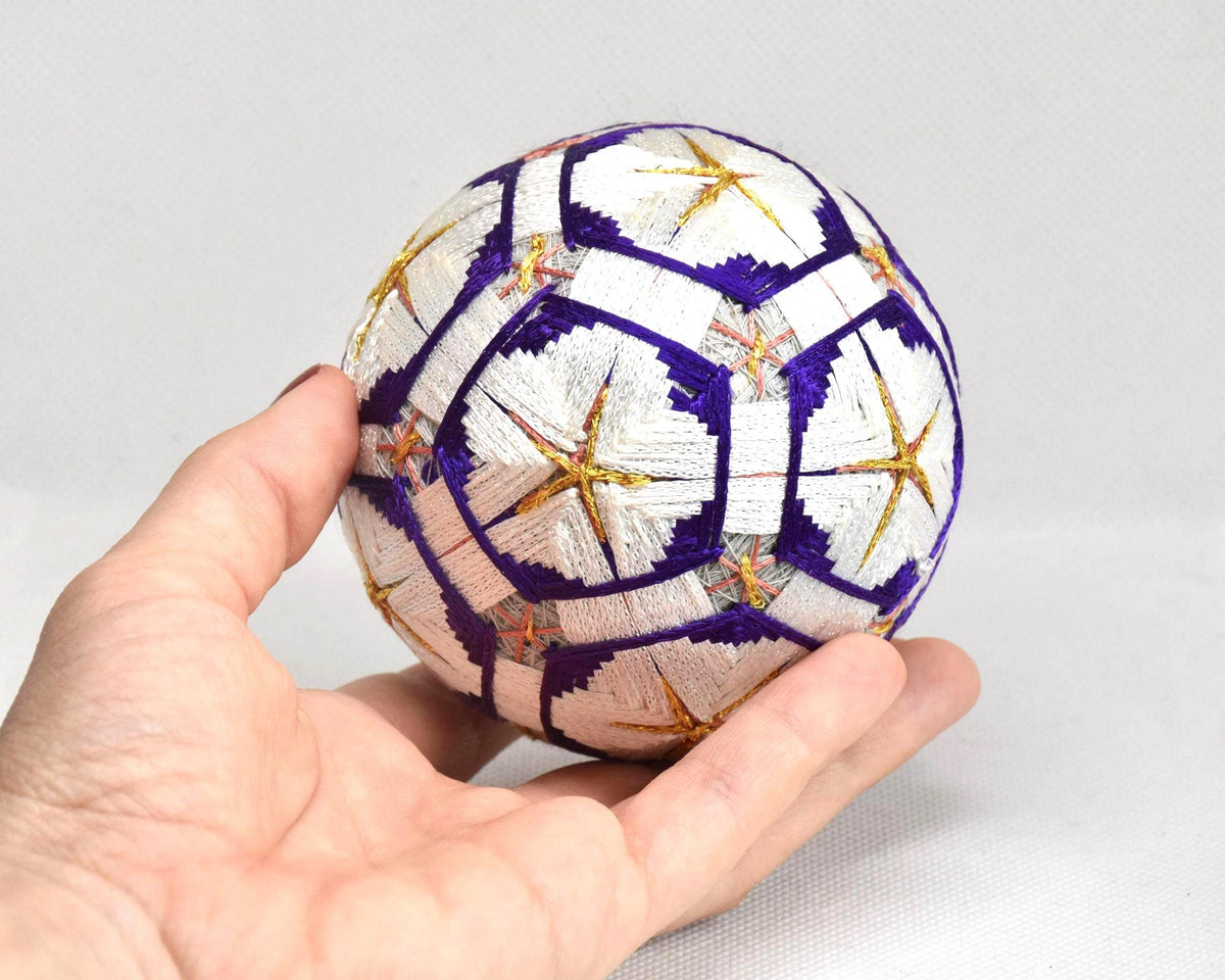 Hand-Embroidered Traditional Japanese Temari Ball held in a hand for scale