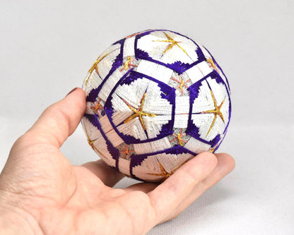 Hand-Embroidered Traditional Japanese Temari Ball held in a hand for scale