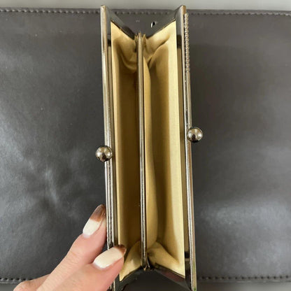 Ueda Tsumugi silk coin purse opened to show dual main compartments and soft lining