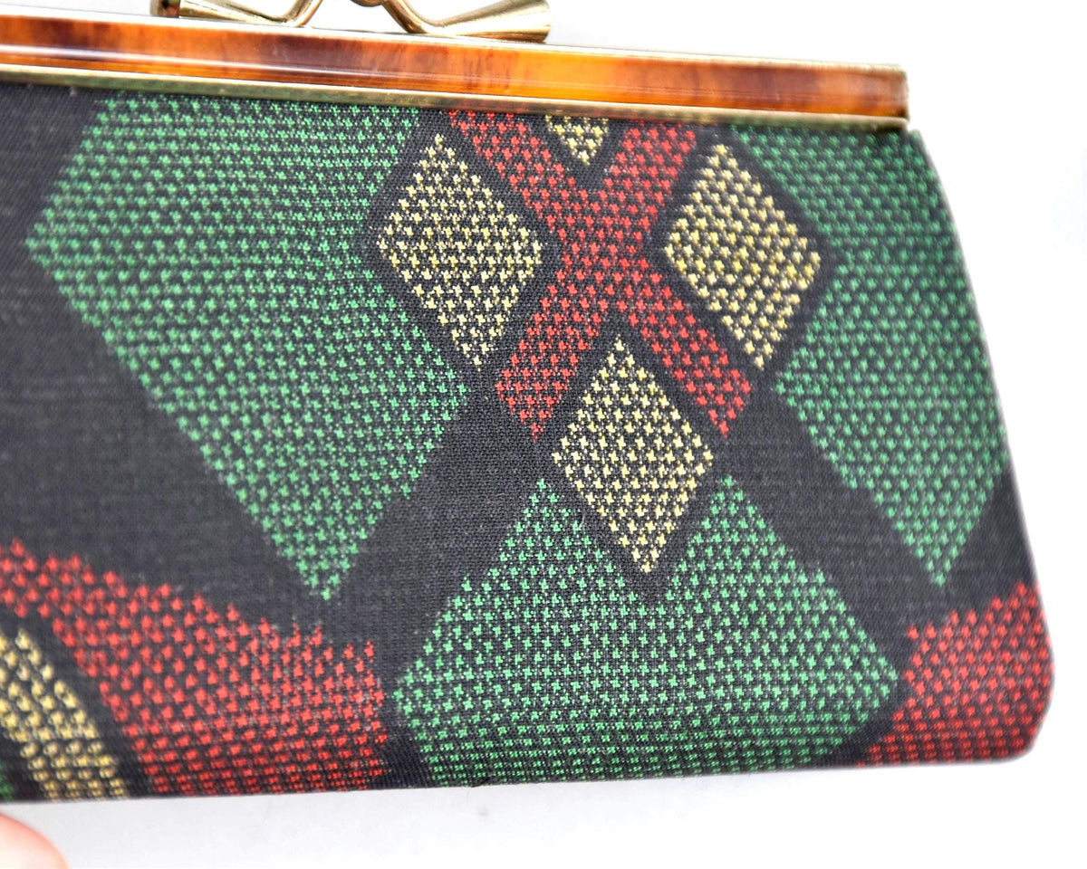Green Oshima Tsumugi Silk Gamaguchi Coin Purse close-up of the patterned silk weave.