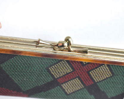 Green Oshima Tsumugi Silk Gamaguchi Coin Purse close-up of the metal gamaguchi clasp.