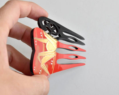 Kanzashi Hair Comb Origami Crane Red And Black Lacquer held in hand showing thickness and crest