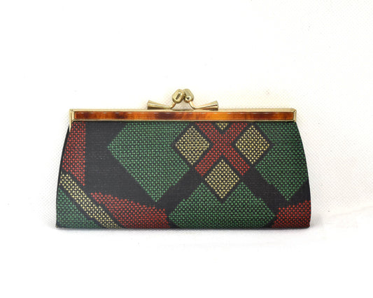 Green Oshima Tsumugi Silk Gamaguchi Coin Purse featuring mud-dyed fabric and a brass clasp.