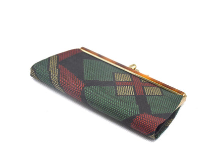 Green Oshima Tsumugi Silk Gamaguchi Coin Purse angled view showing the geometric textile.