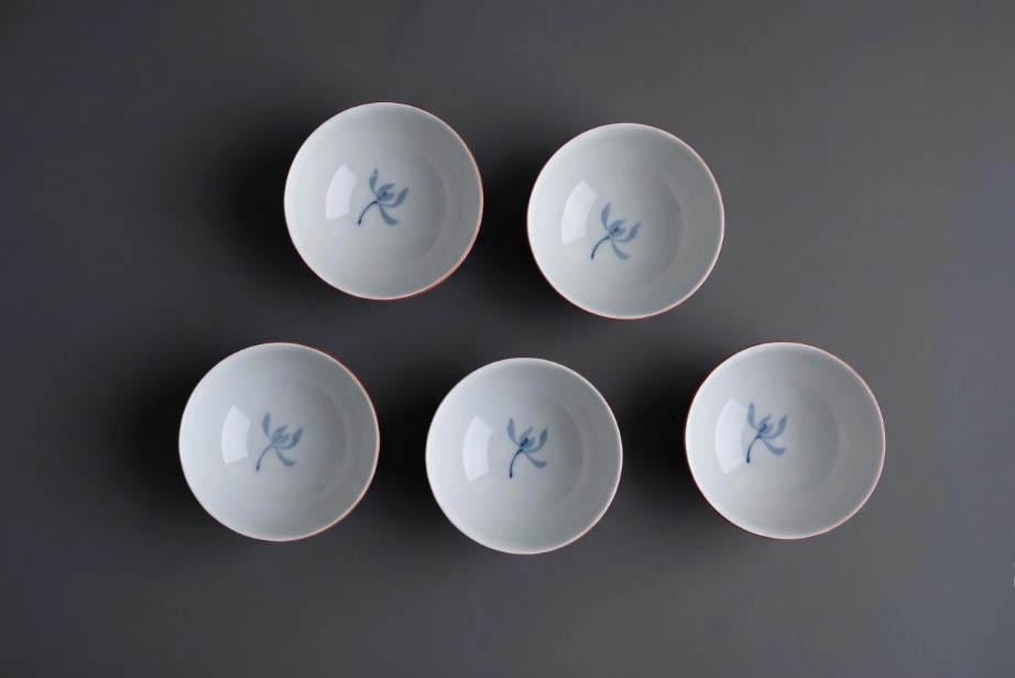 Koransha tea cup set showing the crisp white interior and blue painted floral pattern detail