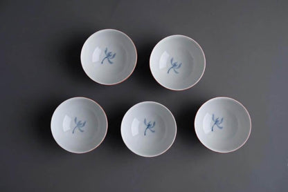 Koransha tea cup set showing the crisp white interior and blue painted floral pattern detail