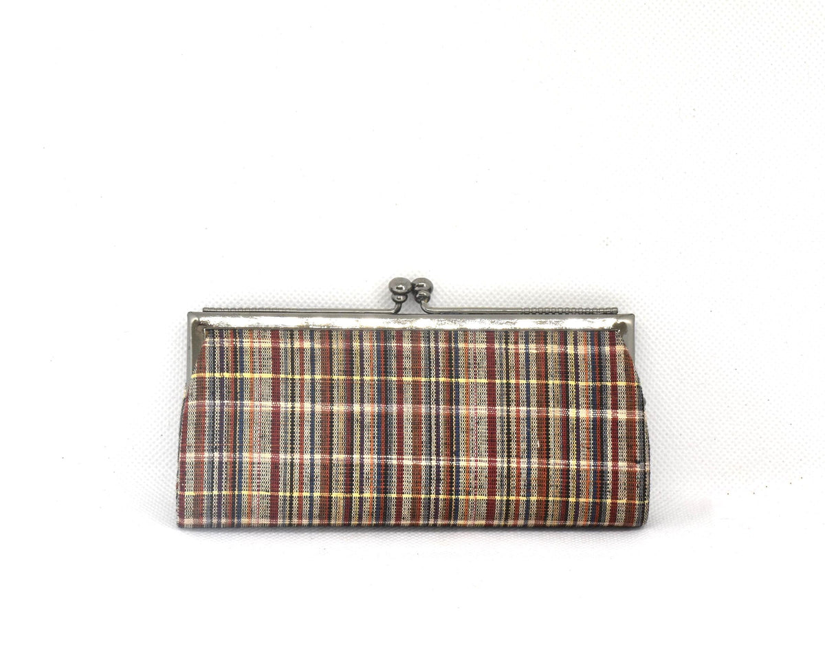 Ueda Tsumugi silk coin purse displayed straight on against a light textured background