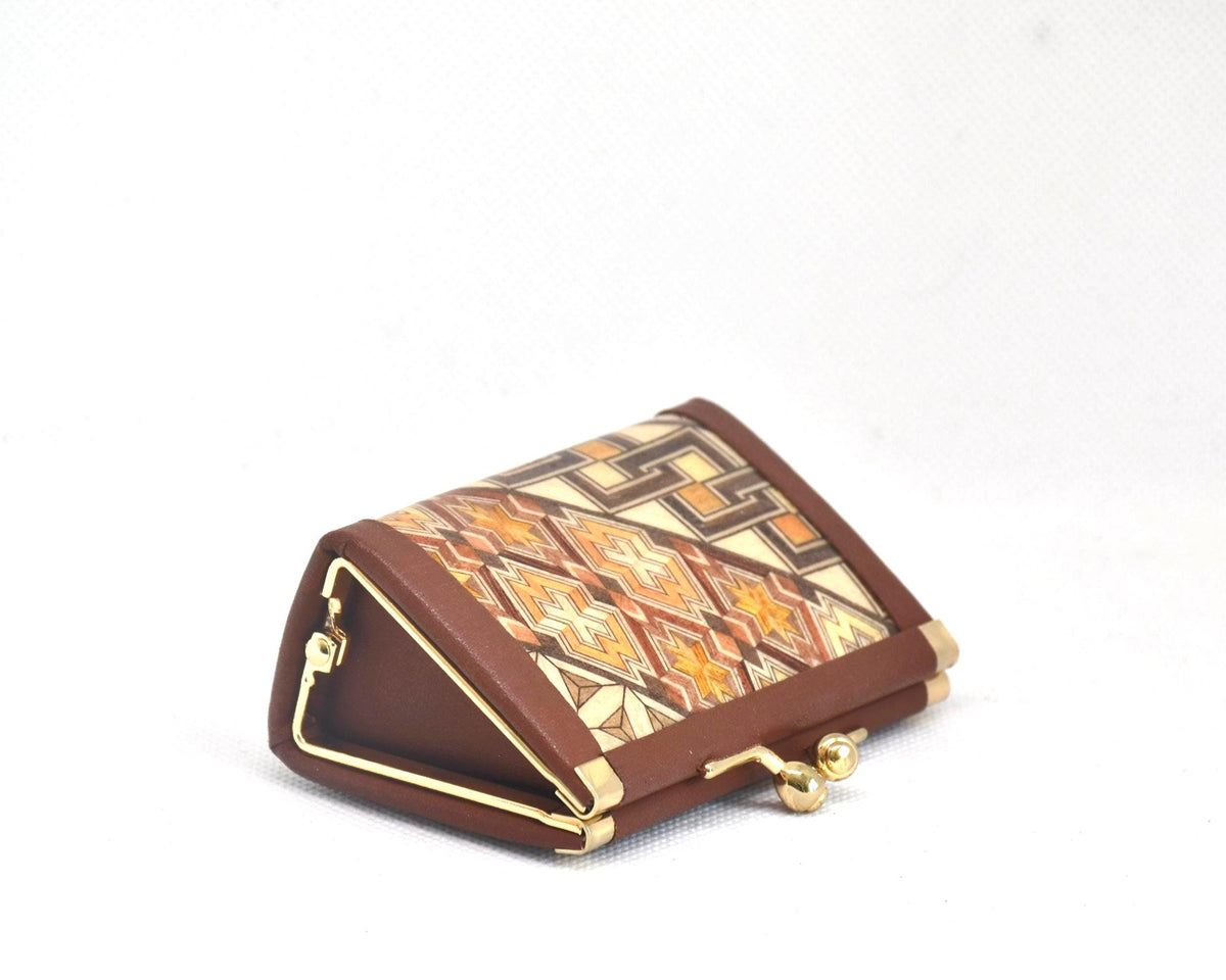Yosegi Zaiku coin purse angled view showing triangular side profile