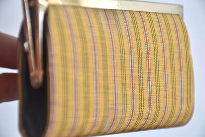 Kihachijo silk coin purse close-up on woven silk fabric pattern detail