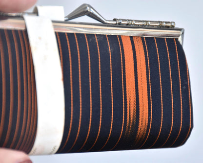 Nishijin-Ori Silk Gamaguchi Purse Black Copper Stripe close up of the black and copper weave