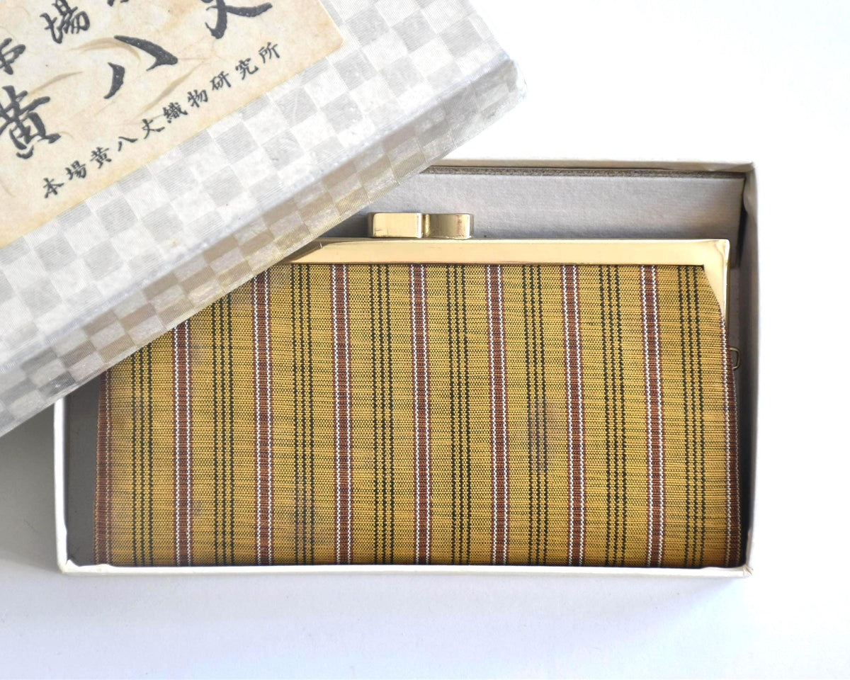 Kihachijo silk coin purse placed inside its original storage box with label on lid