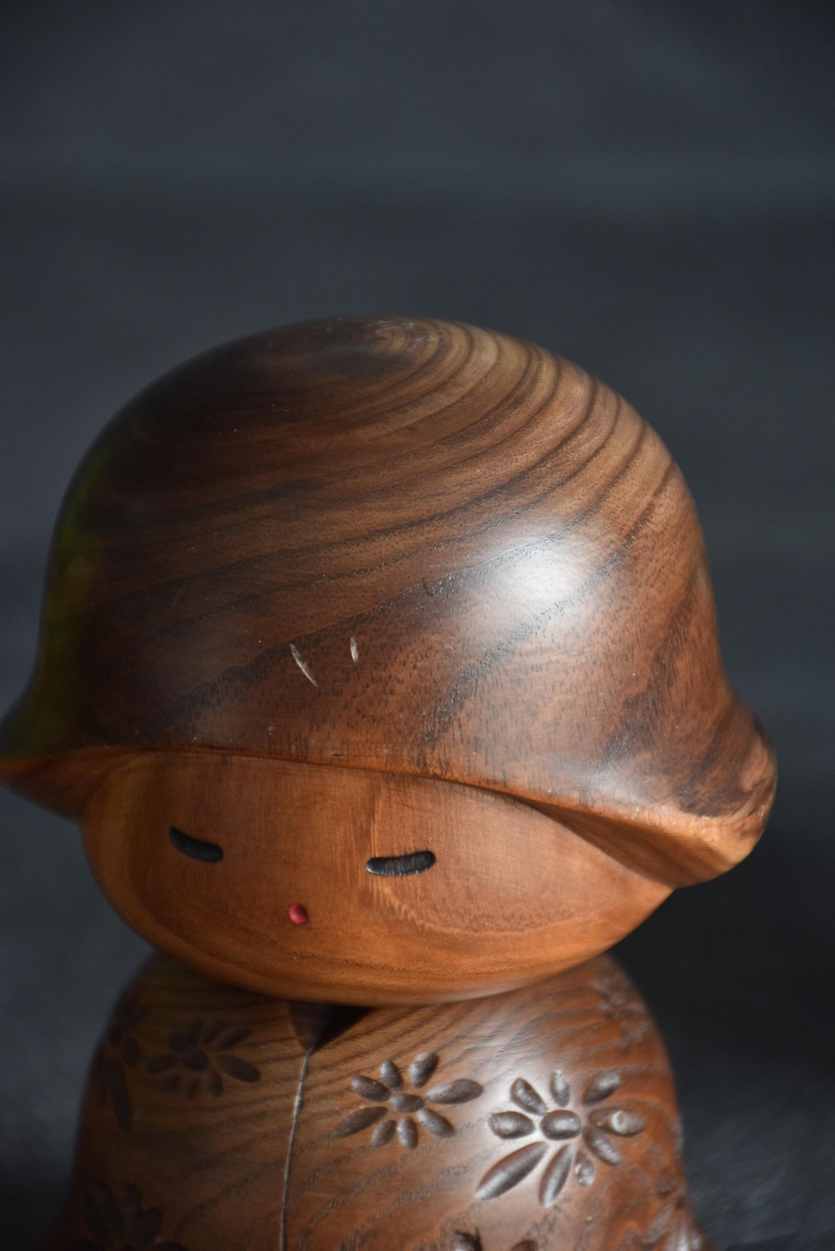 Takeda Masashi kokeshi doll showing face close-up and forehead