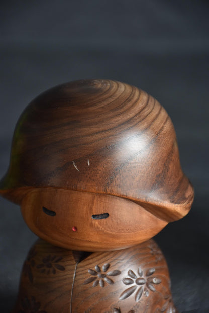 Takeda Masashi kokeshi doll showing face close-up and forehead