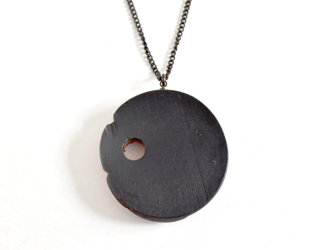 Ainu hand-carved wooden floral medallion necklace back view