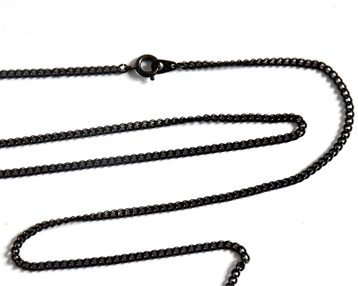 Ainu hand-carved wooden floral medallion necklace dark gunmetal curb chain clasp