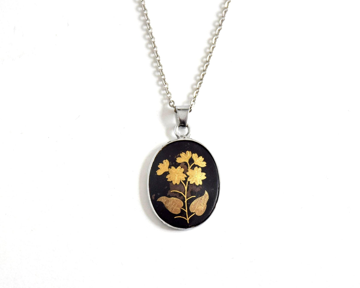 Japanese Zogan Floral Pendant Gold Inlay Damascene necklace on white surface
