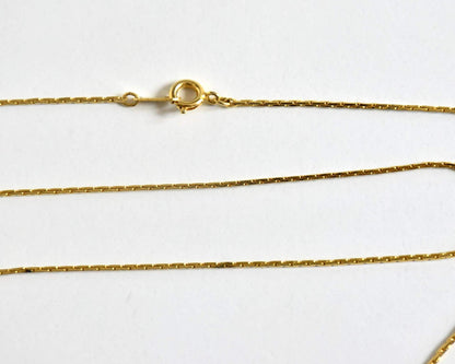 Ainu handcarved wood pendant necklace close up of the gold-tone chain clasp