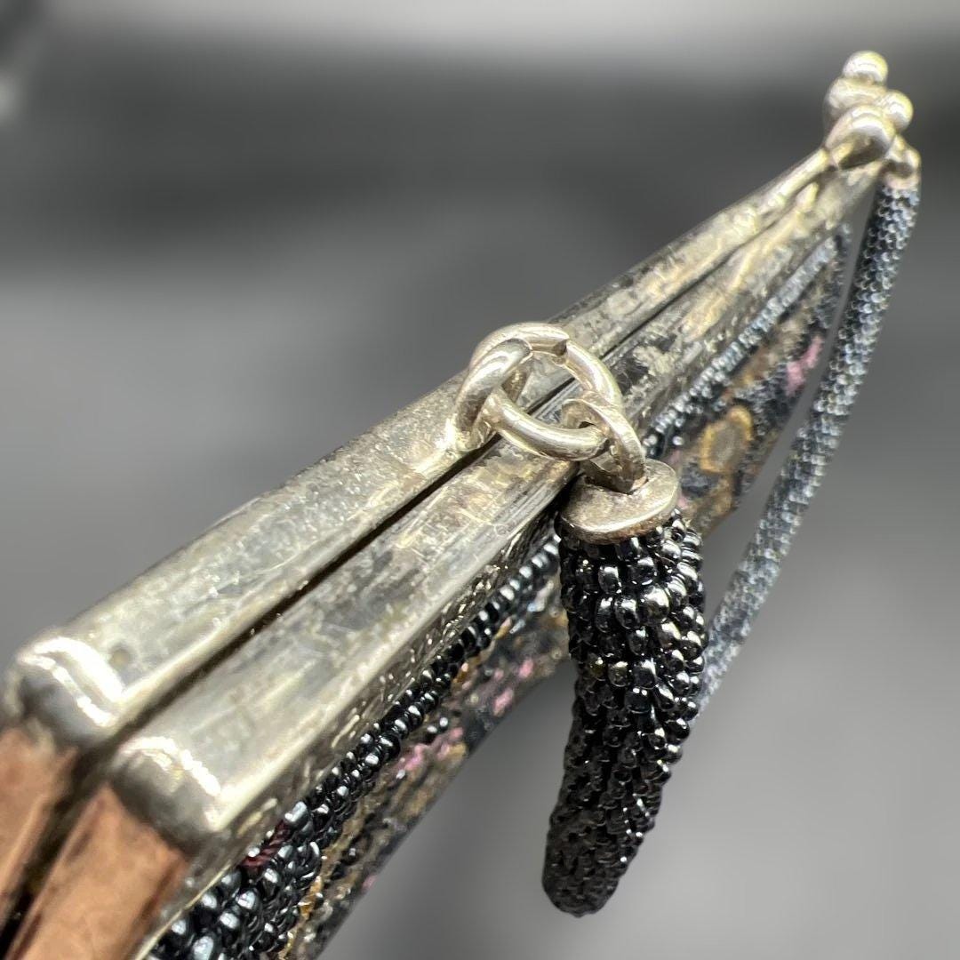 Japanese beaded handbag clasp detail showing the metal frame and hardware