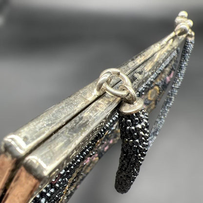 Japanese beaded handbag clasp detail showing the metal frame and hardware