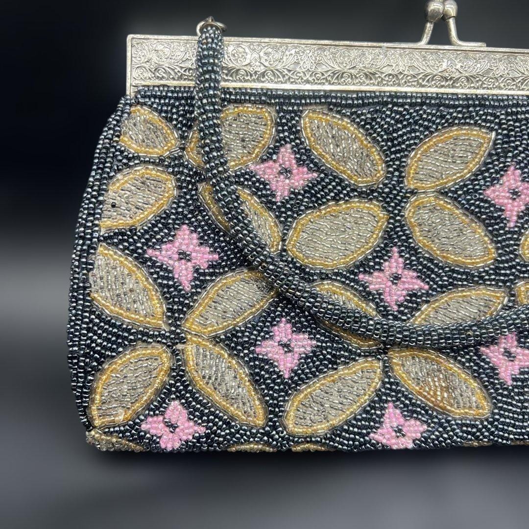 Japanese beaded handbag pattern detail showing gold and pink floral motifs on black base