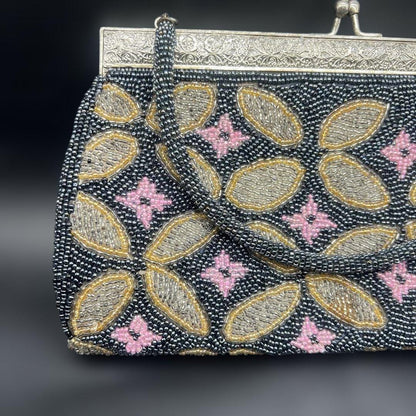 Japanese beaded handbag pattern detail showing gold and pink floral motifs on black base